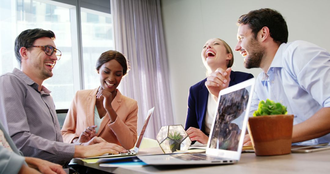 Cheerful Business Team Collaborating in Modern Office