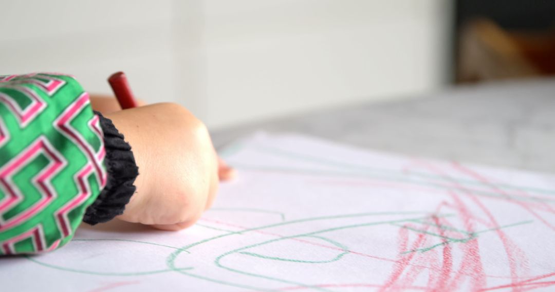 Child Drawing with Crayons at Home Creativity Concept
