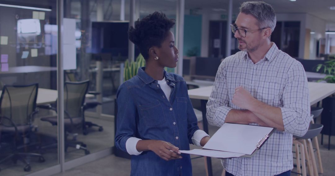 Business Colleagues Discussing Project Details in Modern Office