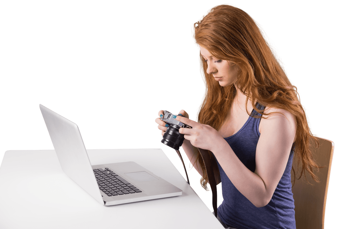 Focused Redhead Using Camera at Laptop on Transparent Background