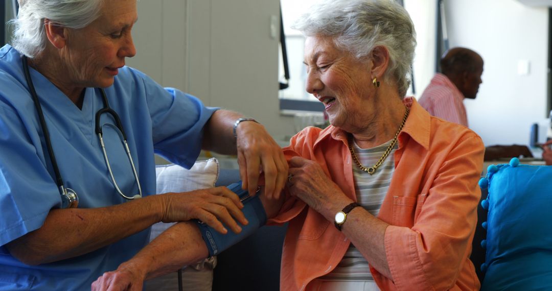 Nurse Checking Blood Pressure of Elderly Woman in Senior Care Center - Free Images, Stock Photos and Pictures on Pikwizard.com