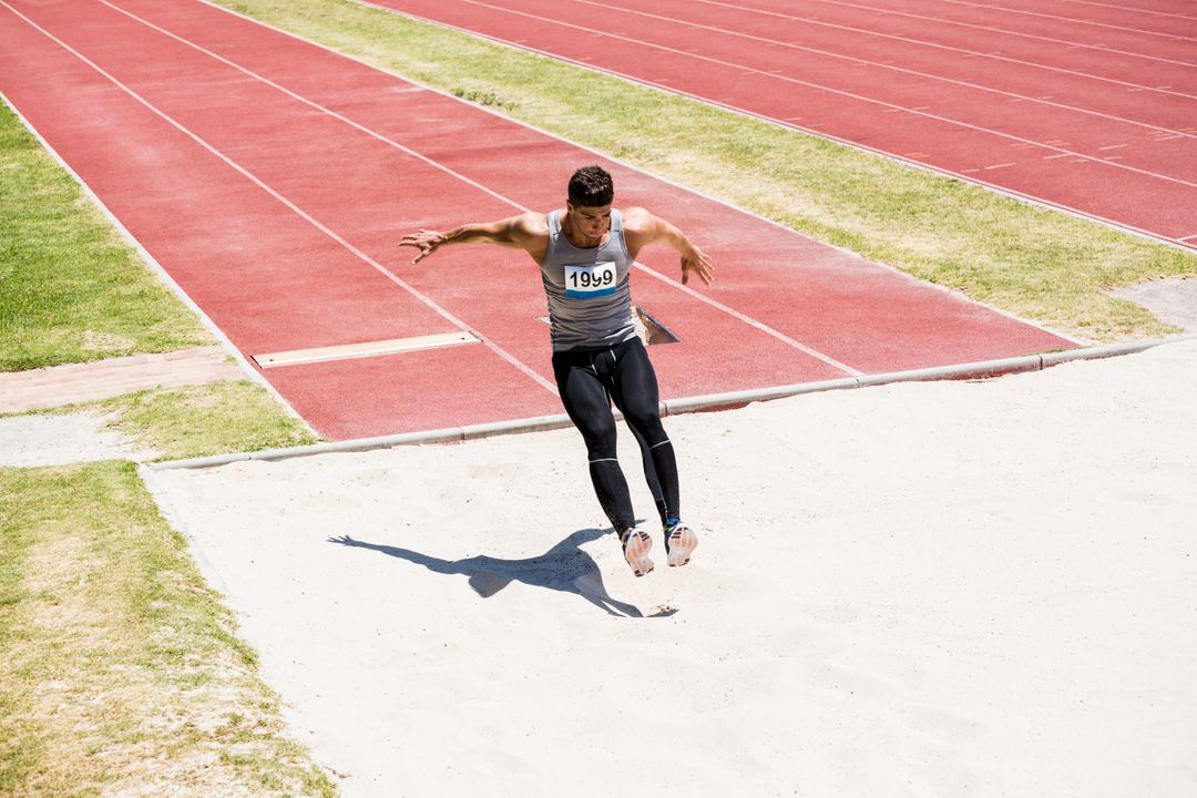 Athlete performing a long jump - Free Images, Stock Photos and Pictures on Pikwizard.com
