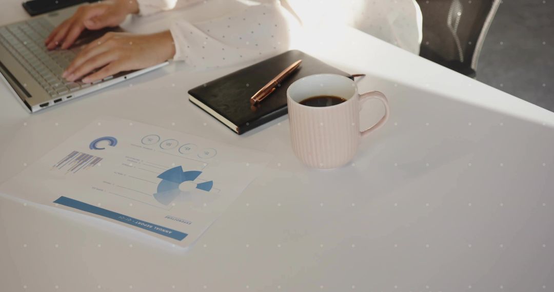 Professional Female Worker Typing at Modern Office Desk with Documents