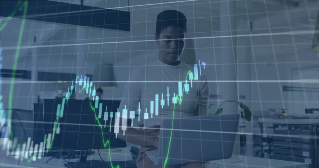 Diverse Business Team Analyzing Financial Data Graphs in Modern Office