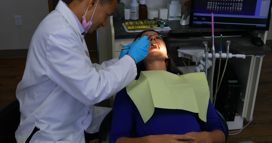 Patient Receiving Dental Checkup from Dentist in Dental Clinic - Free Images, Stock Photos and Pictures on Pikwizard.com