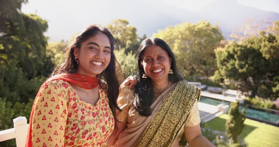 Mother and Daughter Enjoying Family Time Outside with Smiles