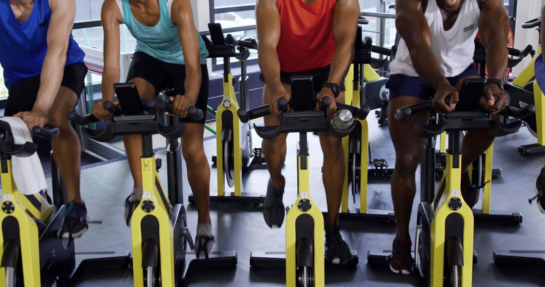 Diverse People Exercising on Stationary Bikes at Gym - Free Images, Stock Photos and Pictures on Pikwizard.com