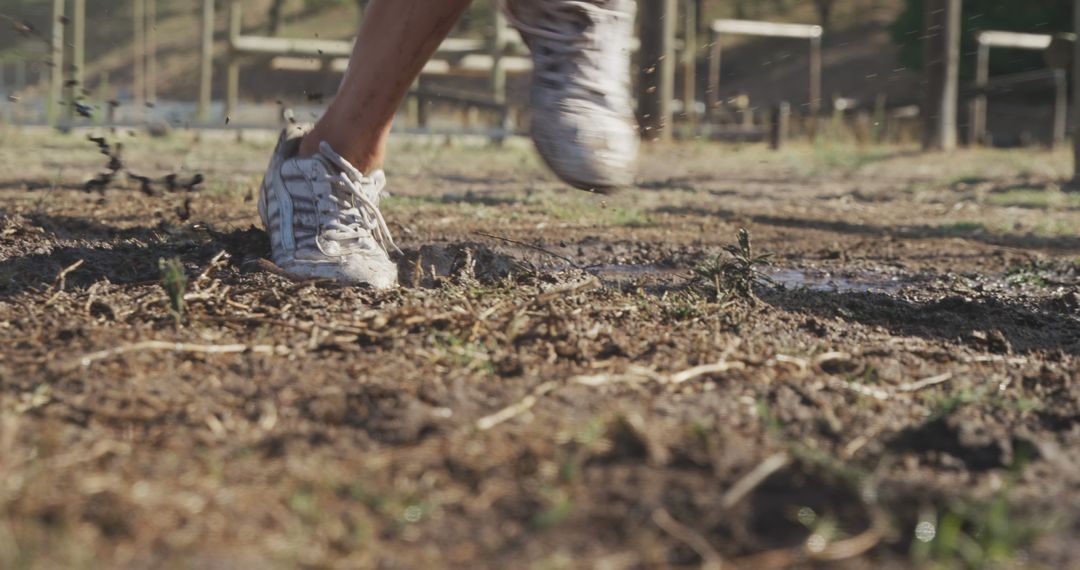 Athlete Running on Muddy Trail, Close-up of Legs and Shoes - Free Images, Stock Photos and Pictures on Pikwizard.com