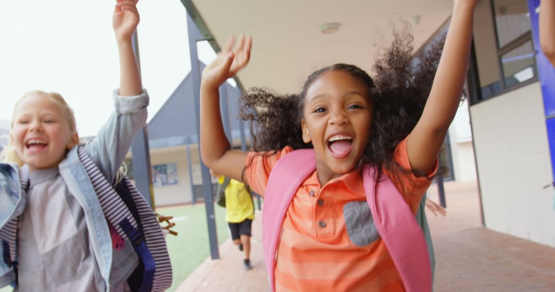Schoolchildren Joyfully Running with Backpacks in School Corridor