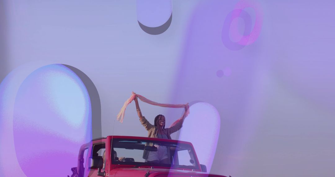 Joyful Road Trip in Red Convertible with Stylish Friends