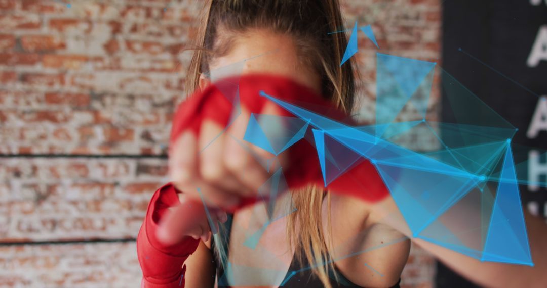 Fit Woman Punching in Boxing Gloves with Digital Effects - Free Images, Stock Photos and Pictures on Pikwizard.com