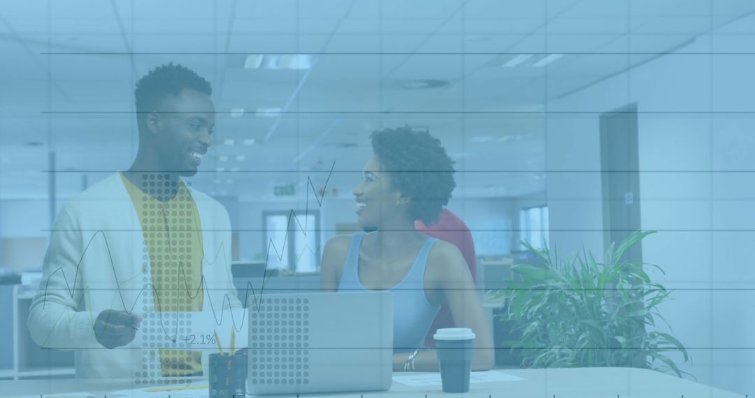 Smiling Colleagues Collaborating in Modern Office Environment