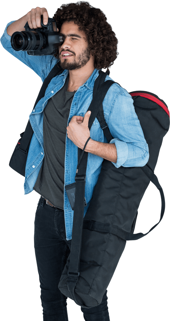 Male Photographer Shooting While Carrying Equipment with Transparent Background