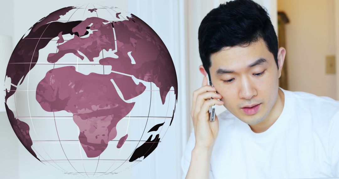 Asian Man Discussing International Business on Phone with World Map Overlay - Free Images, Stock Photos and Pictures on Pikwizard.com