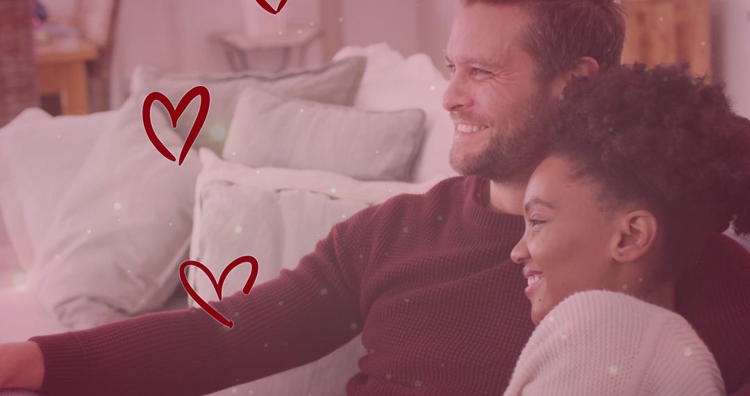 Diverse Couple Embracing on Sofa with Romantic Overlay Effects