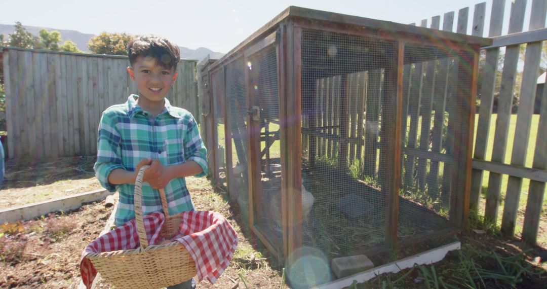 Happy Boy Holding Basket Near Chicken Coop In Backyard - Free Images, Stock Photos and Pictures on Pikwizard.com