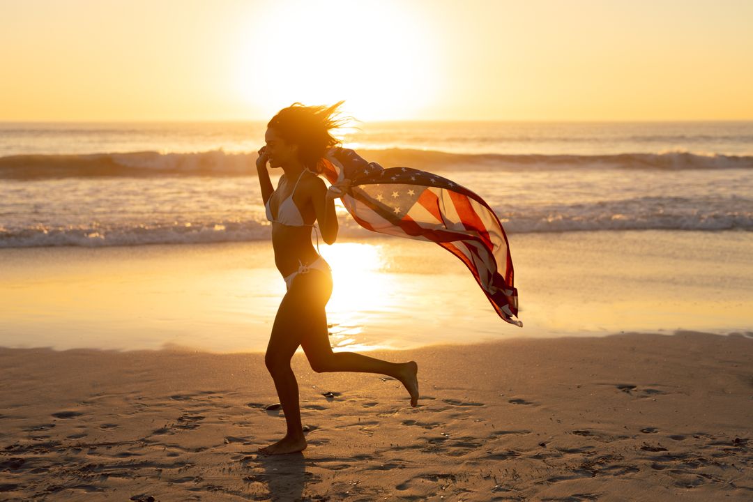 Young Woman Running on Beach with American Flag at Sunset - Free Images, Stock Photos and Pictures on Pikwizard.com