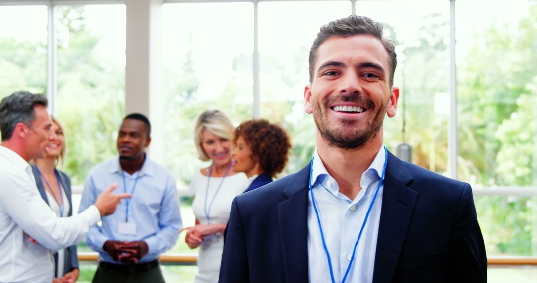 Confident Businessman Attending Corporate Networking Event - Free Images, Stock Photos and Pictures on Pikwizard.com