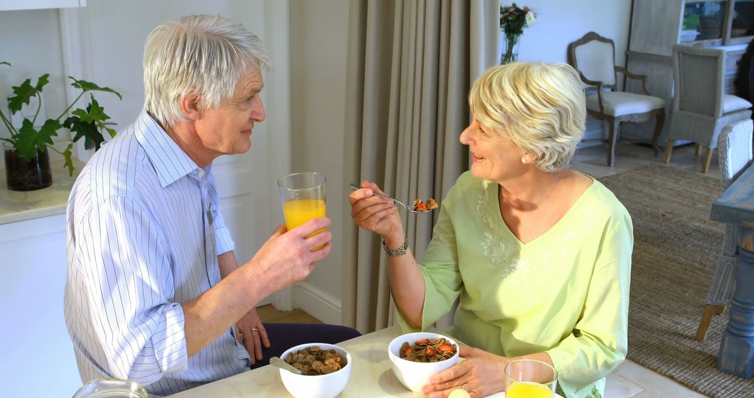 Senior Couple Enjoying Healthy Breakfast Together in Cozy Home - Free Images, Stock Photos and Pictures on Pikwizard.com