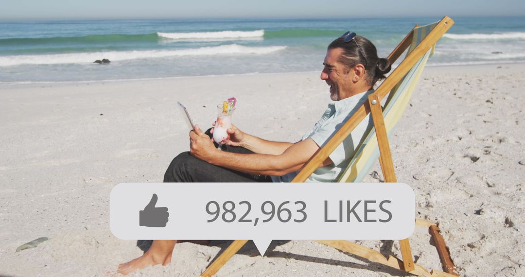 Man Relaxing on Beach with Tablet Enjoying Social Media