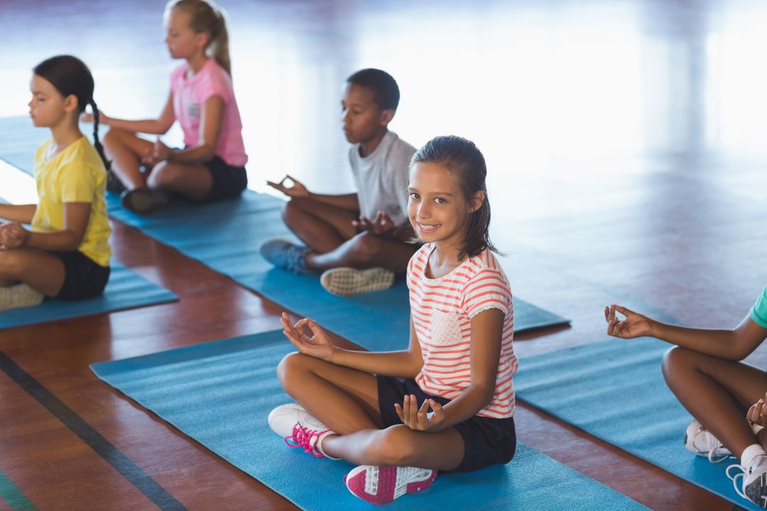 School kids meditating during yoga class - Free Images, Stock Photos and Pictures on Pikwizard.com