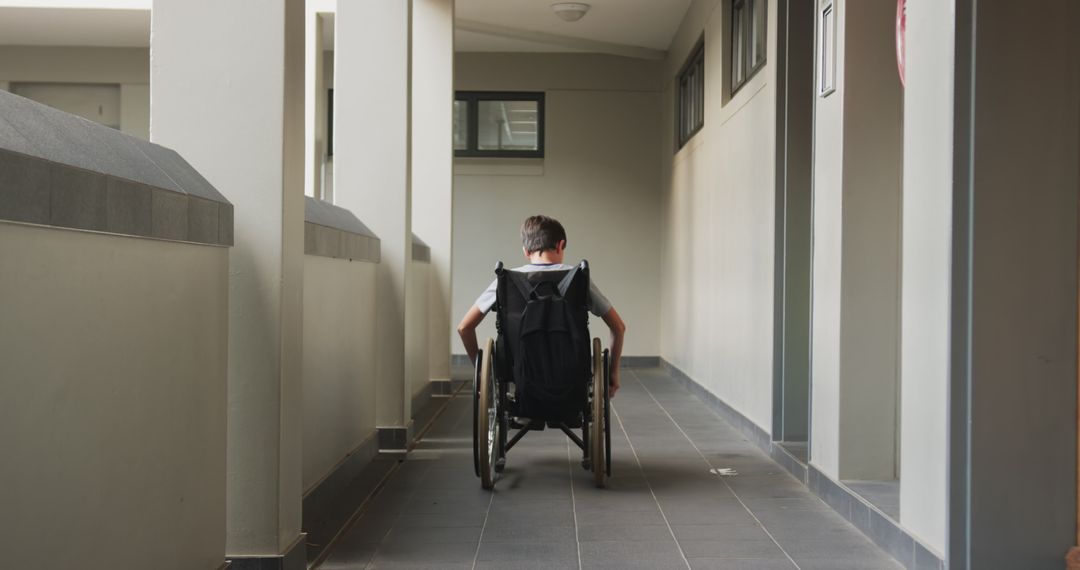 Child in Wheelchair Navigating Educational Corridor for Accessibly-Focused Motivation