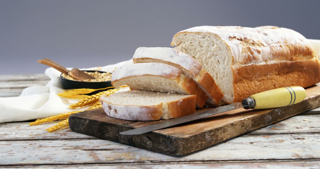 Freshly Baked Artisan Bread Sliced on Rustic Wooden Board - Free Images, Stock Photos and Pictures on Pikwizard.com