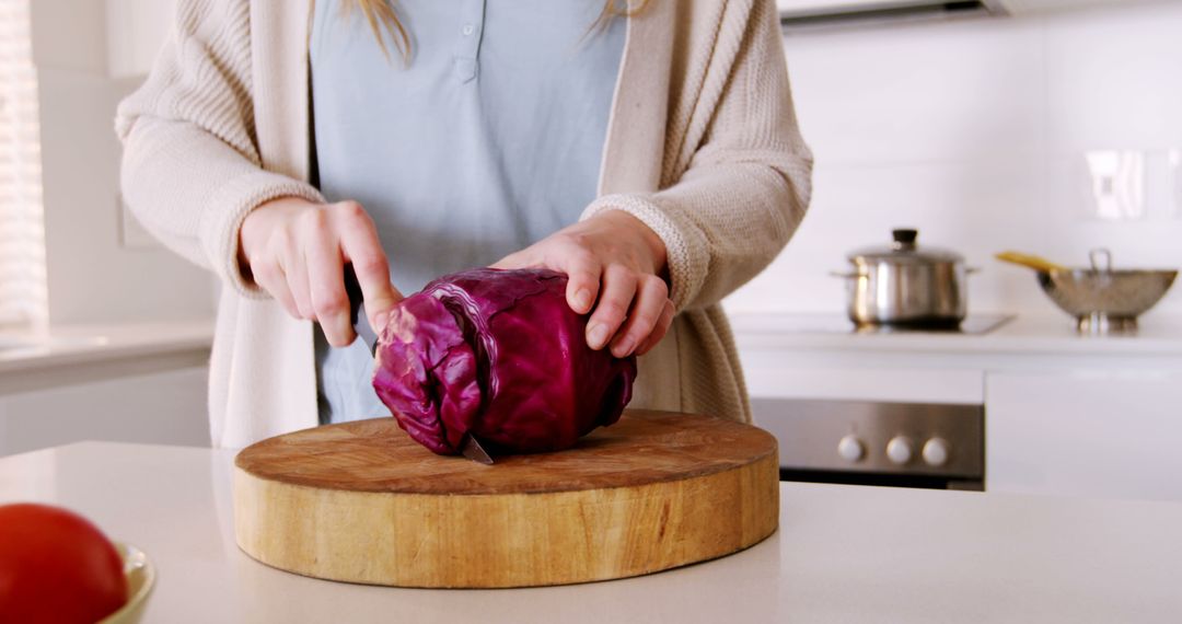 Woman Preparing Purple Cabbage in Modern Kitchen - Free Images, Stock Photos and Pictures on Pikwizard.com