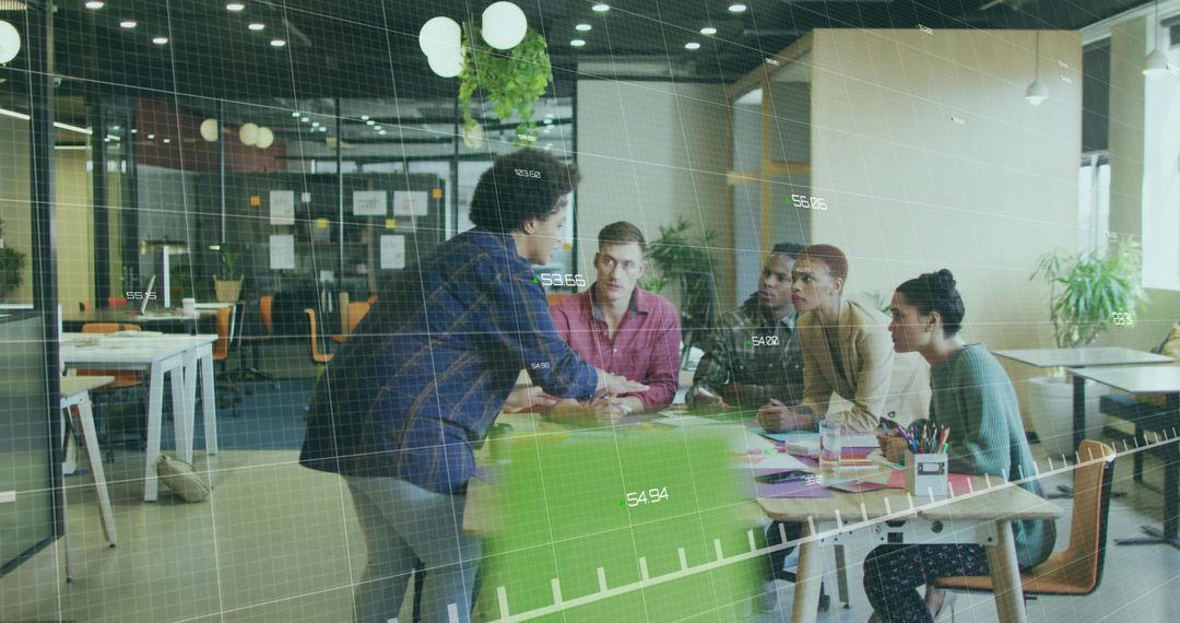 Team Members Collaborating Around Office Table on Project