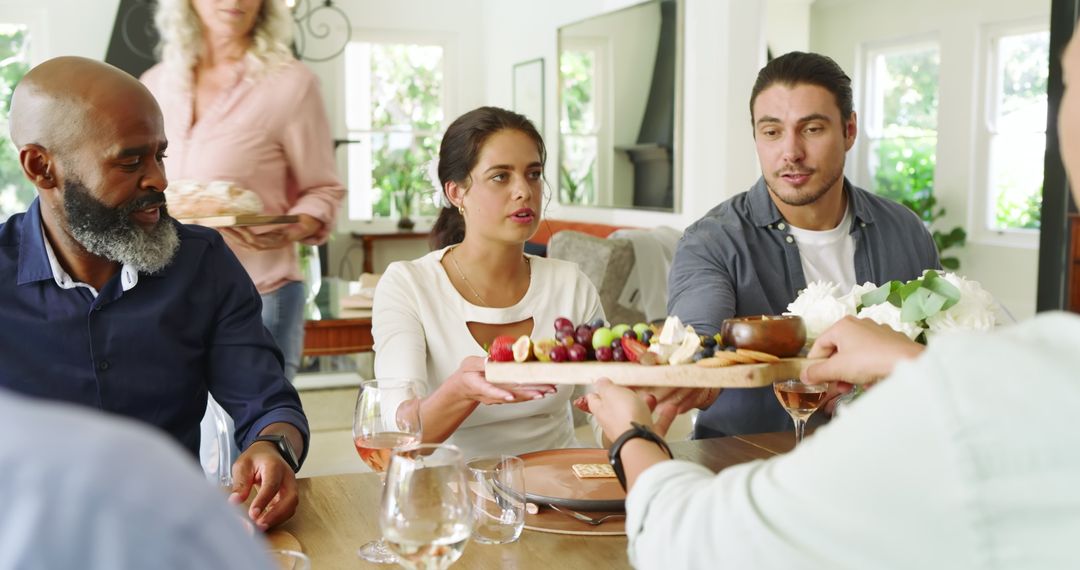 Diverse Group Enjoying Dinner Gathering At Home