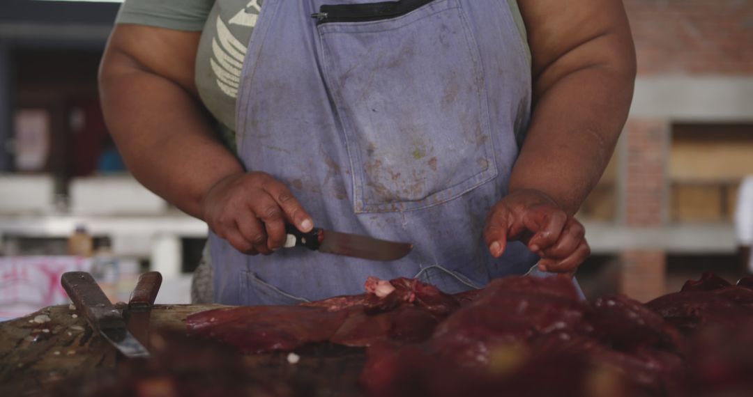 Butcher Cutting Fresh Meat at Market - Free Images, Stock Photos and Pictures on Pikwizard.com