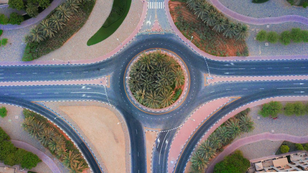 Aerial View of Geometric Palm-Rounded Intersection in Desert City
