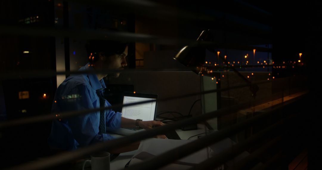 Person Working Late at Night in Office, Reflections on Window - Free Images, Stock Photos and Pictures on Pikwizard.com