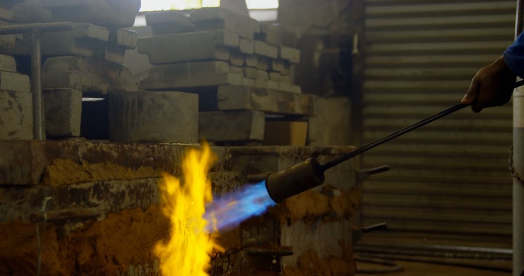 Blacksmith Using Torch to Heat Metal in Workshop - Free Images, Stock Photos and Pictures on Pikwizard.com