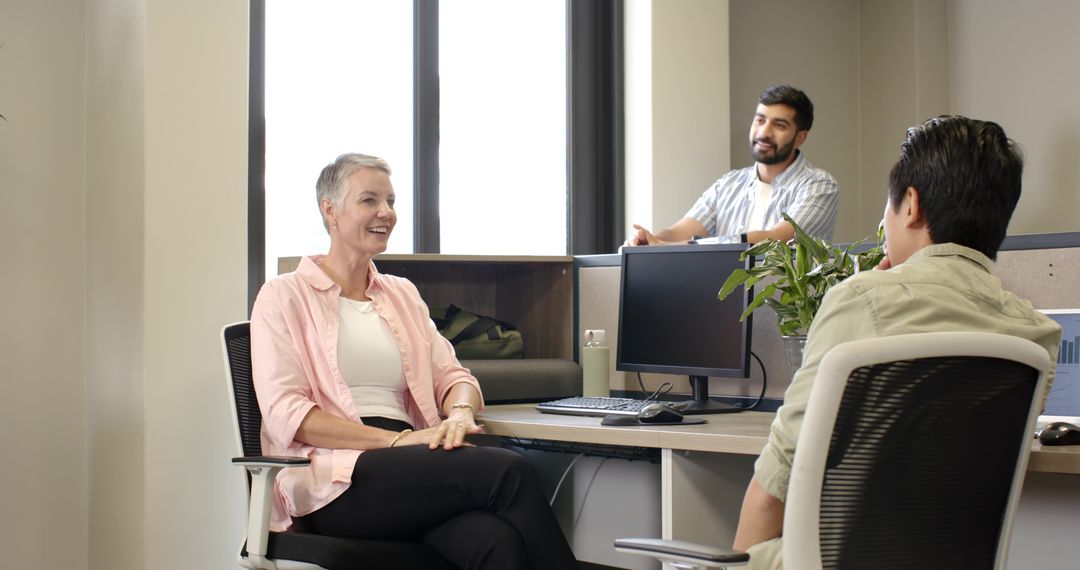 Diverse Coworkers Engaging in Collaborative Office Discussion