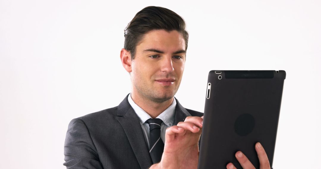 Confident Businessman Using Tablet for Professional Tasks