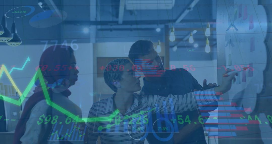 Diverse Team Analyzing Data Visualizations in Office