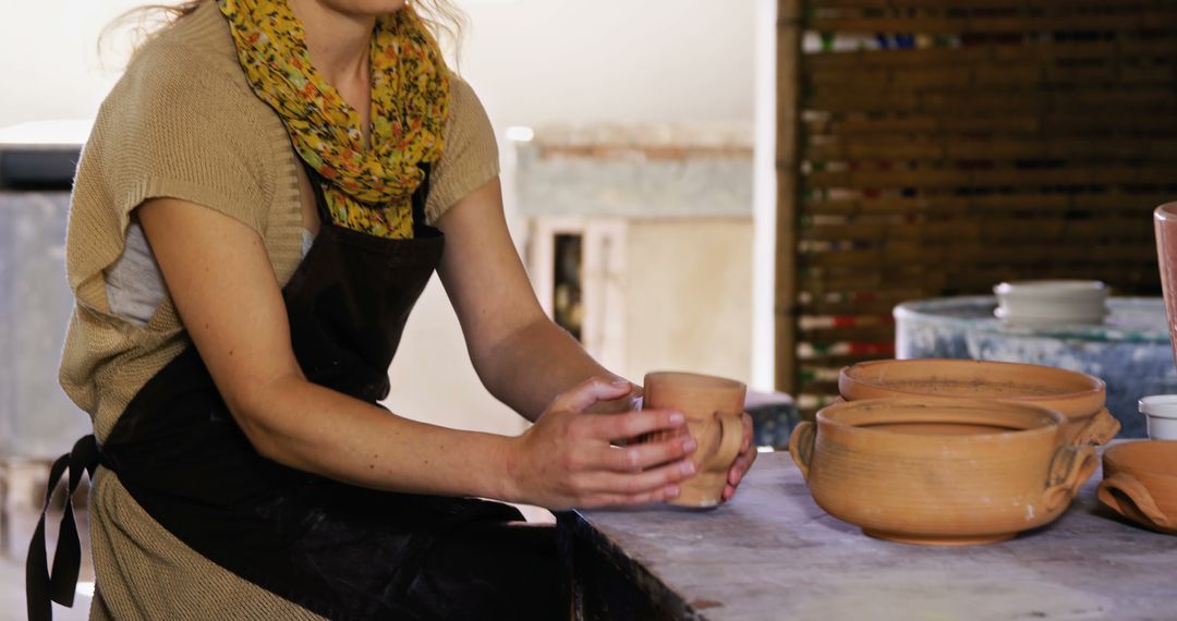 Woman Working on Pottery Craft at Rustic Workshop - Free Images, Stock Photos and Pictures on Pikwizard.com