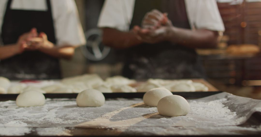 Bakers Shaping Dough in Artisan Bakery - Free Images, Stock Photos and Pictures on Pikwizard.com