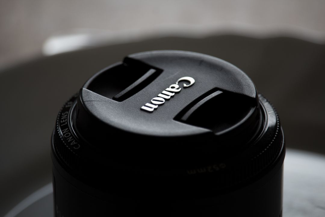 Close-Up Photograph of Canon Lens Cap on Camera - Free Images, Stock Photos and Pictures on Pikwizard.com