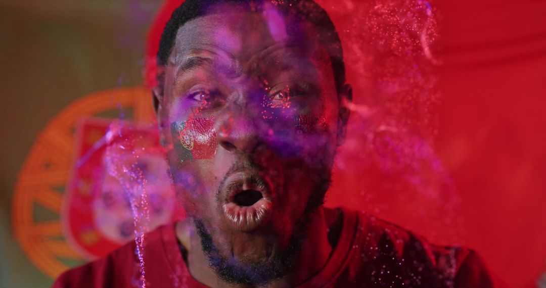 Energetic Man with Flag Face Paint Released Colors of Celebration