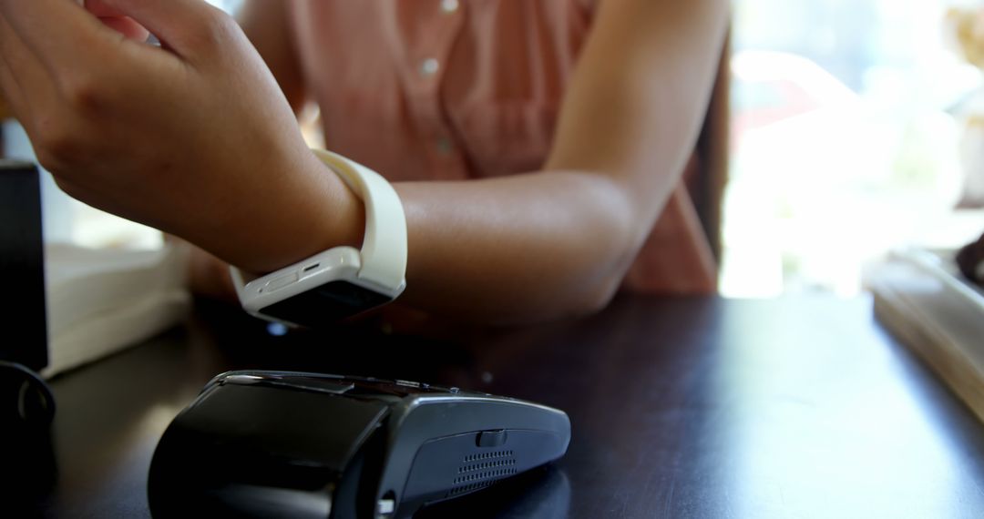 Person Using Smartwatch for Contactless Payment - Free Images, Stock Photos and Pictures on Pikwizard.com