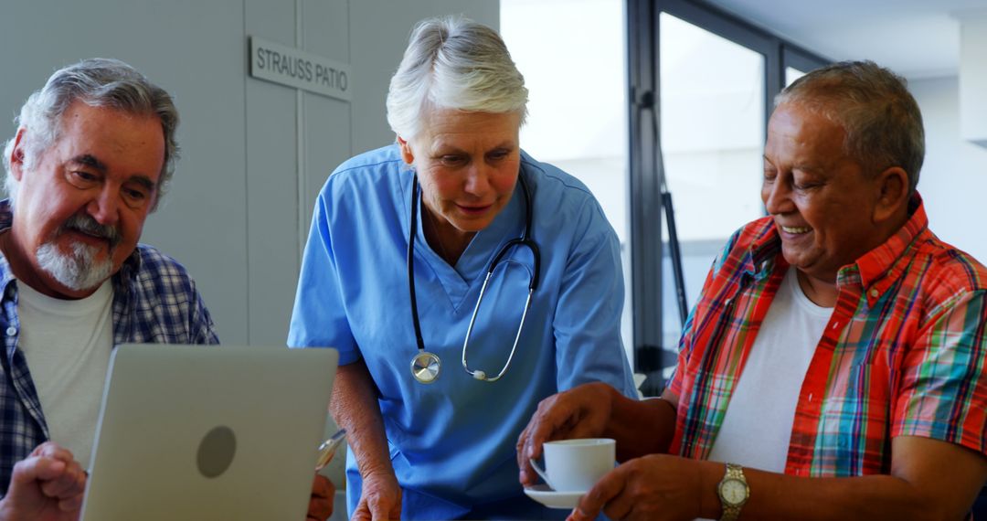 Nurse Discussing Health with Senior Men in Nursing Home - Free Images, Stock Photos and Pictures on Pikwizard.com