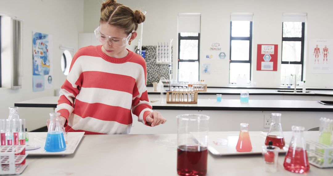 Young Scientist Performing Chemistry Experiment in Science Classroom