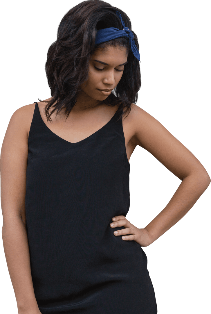 Stylish Young Woman Posing with Hand on Hip in Front of Wood