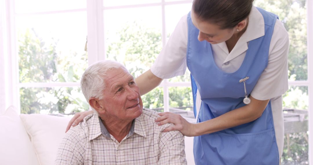 Caring Nurse Assisting Elderly Man at Home - Free Images, Stock Photos and Pictures on Pikwizard.com