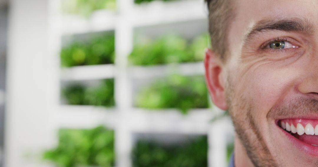 Close-Up of Smiling Man With Indoor Plants in Background - Free Images, Stock Photos and Pictures on Pikwizard.com