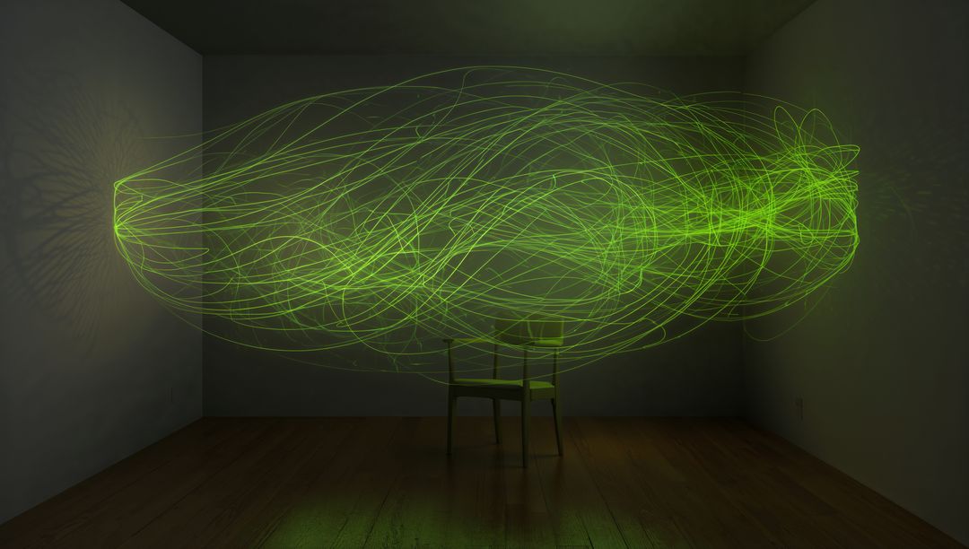 Floating emerald light sculpture surrounding chair with glowing neon loops and reflections
