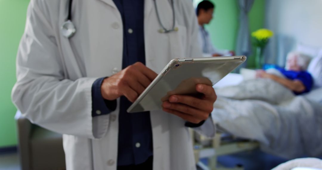 Doctor Using Digital Tablet While Caring for Patient in Hospital - Free Images, Stock Photos and Pictures on Pikwizard.com