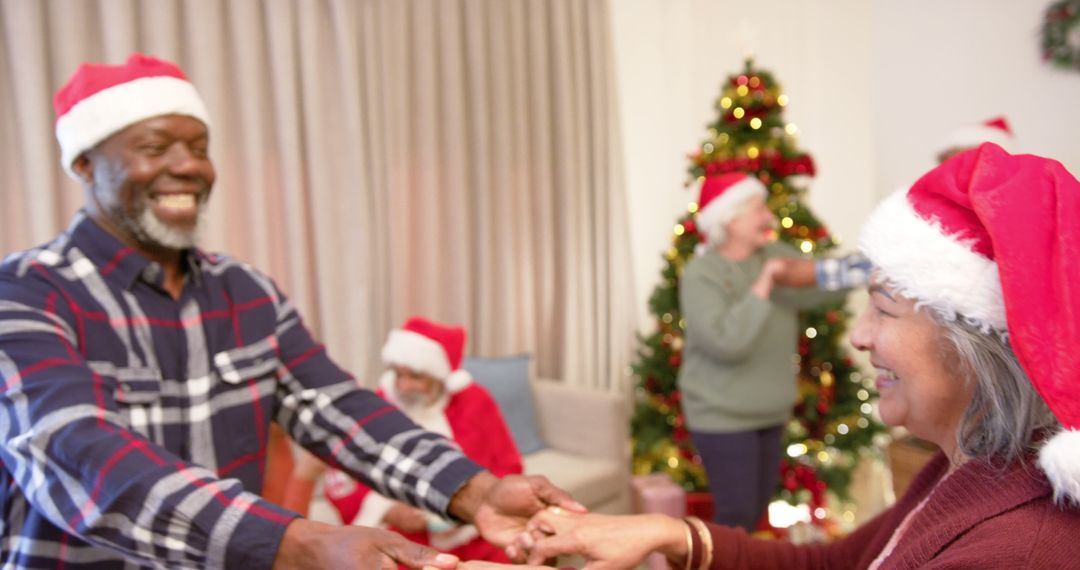 Elderly Couple Dancing and Celebrating Christmas at Home - Free Images, Stock Photos and Pictures on Pikwizard.com